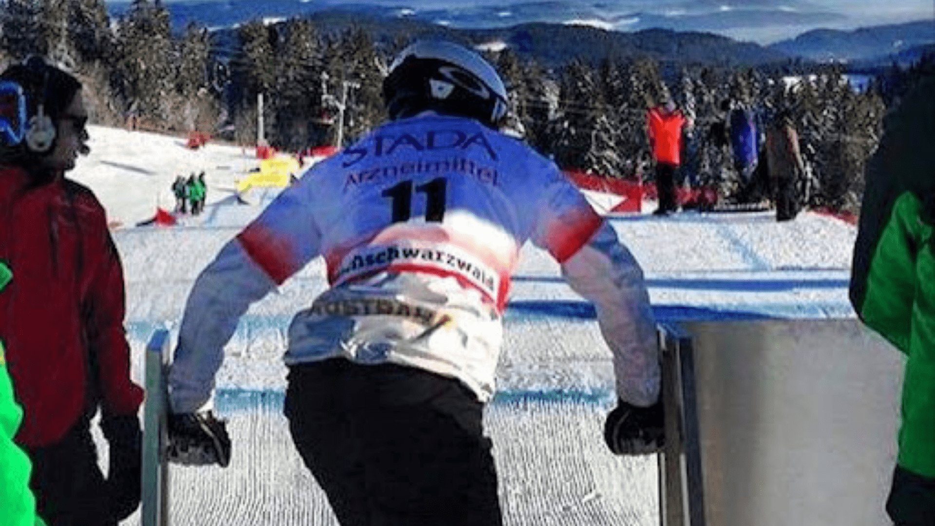 Snowboarder in a white and red uniform.