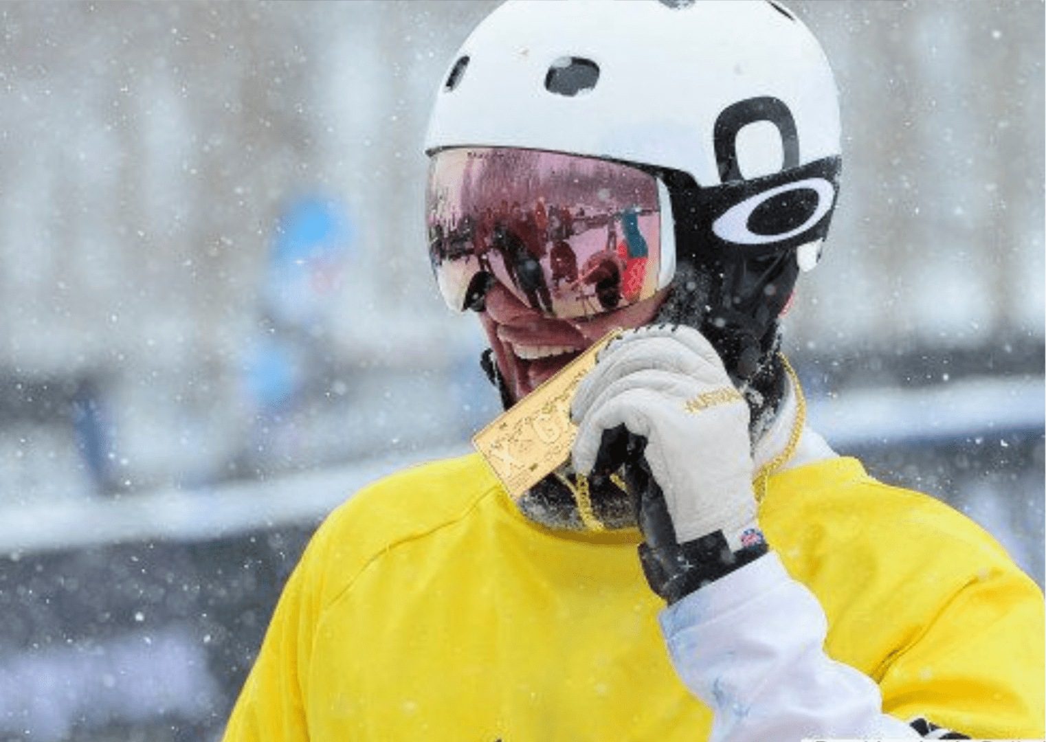 A person wearing a helmet and holding something in his mouth.